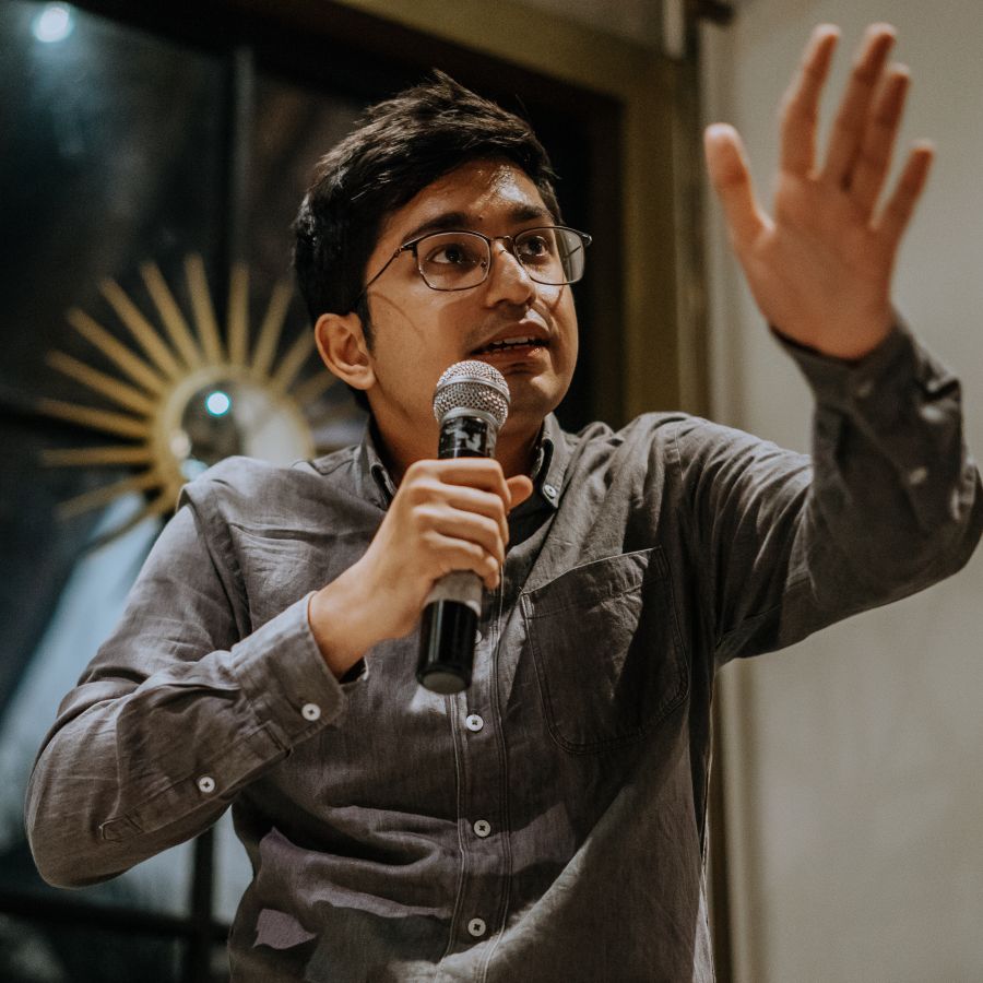 Sukraj Putera, founder of Senin Agency, with a microphone